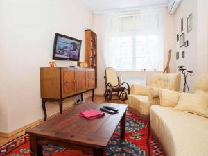 a living room with a couch and a coffee table at Apartment Markale in Sarajevo