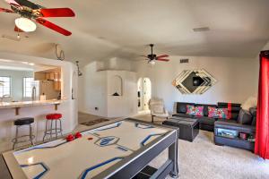 a living room with a couch and a table at Patio, Rooftop Deck and Mtn Views Lake Havasu Home! in Lake Havasu City