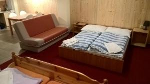 Postel nebo postele na pokoji v ubytování Studia Pod Lysou