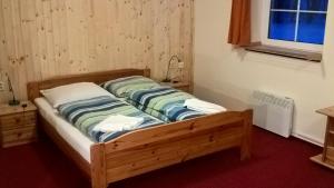Postel nebo postele na pokoji v ubytování Studia Pod Lysou