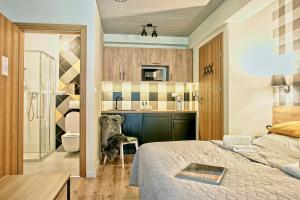 Posteľ alebo postele v izbe v ubytovaní Apartamenty Magia Gór