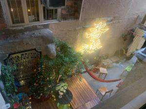 an overhead view of a patio with a christmas tree and a bench at Wontonmeen in Hong Kong