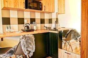 Kuchyňa alebo kuchynka v ubytovaní Apartamenty Magia Gór