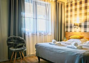 Posteľ alebo postele v izbe v ubytovaní Apartamenty Magia Gór
