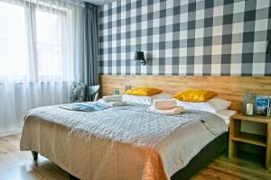 Posteľ alebo postele v izbe v ubytovaní Apartamenty Magia Gór