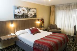 Rúm í herbergi á Hotel Don Eduardo