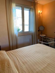 Casa Delle Olive tesisinde bir odada yatak veya yataklar