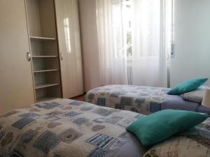 Postel nebo postele na pokoji v ubytování Como Ricky Apartment