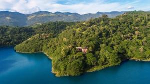 an island in the middle of a body of water at The Hermitage by Edwards Collection in Haragama