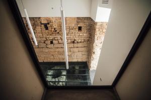 an overhead view of a room with a brick wall at GRAN CANCELLIERE Apartments in Palermo