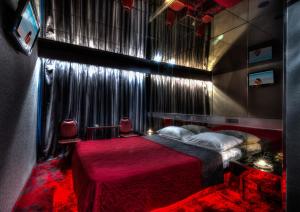 Postel nebo postele na pokoji v ubytování ALFA HOTEL