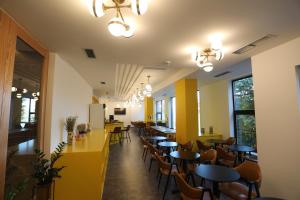 a row of tables and chairs in a restaurant at Elite in Pogradec