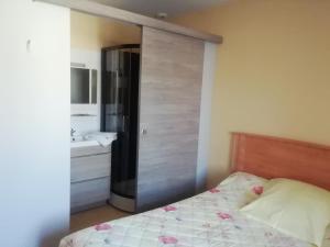 Postel nebo postele na pokoji v ubytování Hôtel Ducret