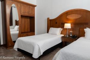 Letto o letti in una camera di Johnscher by SJ - San Juan Curitiba