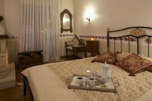 En eller flere senger på et rom på Guesthouse Agonari