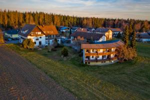 an aerial view of a house in a field at Hotel Sonnenschein in Freudenstadt
