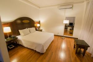 Letto o letti in una camera di Johnscher by SJ - San Juan Curitiba