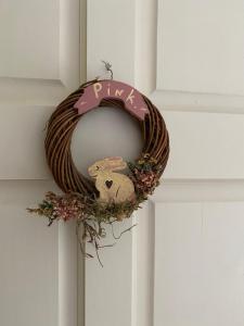 a wreath with a rabbit on a door at River Meadows B&B in Kenmare