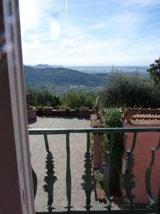 a view from the balcony of a house with plants at Le Donne di Bargecchia in Corsanico-Bargecchia