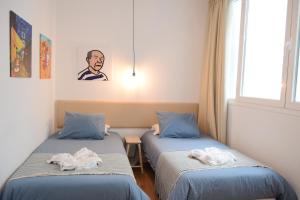 Posteľ alebo postele v izbe v ubytovaní SOHO ARTS DUPLEX CENTRO by AlohaMalaga