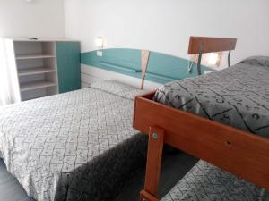 Postel nebo postele na pokoji v ubytování Hotel Alga