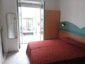 Postel nebo postele na pokoji v ubytování Hotel Alga