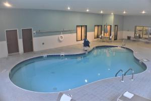 a large swimming pool in a hotel room at Holiday Inn Express - Newell-Chester WV, an IHG Hotel in Newell
