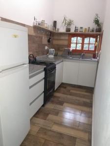 Kuchyň nebo kuchyňský kout v ubytování Cabaña la Florecida