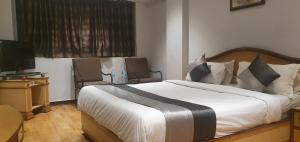 Letto o letti in una camera di Hotel JMC Group