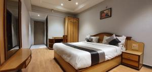 Letto o letti in una camera di Hotel JMC Group
