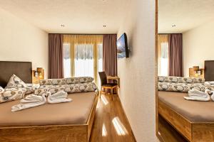 Postel nebo postele na pokoji v ubytování Landhaus Paradies Samnaun Spiss