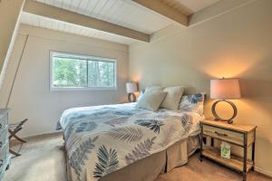 a bedroom with a bed and a window at Near Skiing and Hiking Carnelian Bay Cabin in Carnelian Bay