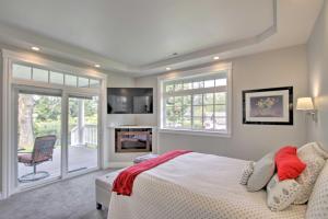 a bedroom with a bed and a fireplace at Contemporary Tacoma Cottage with Deck and Pond! in Tacoma