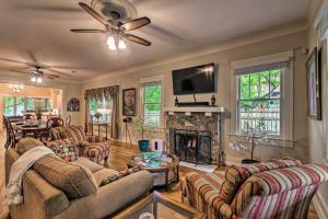a living room with couches and a fireplace at Spacious and Updated 1920s HSNP Craftsmen Home in Hot Springs