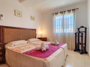 a bedroom with a large bed with two pillows on it at Albatros Playa 1 - Resort Choice 3507 in Mar de Cristal