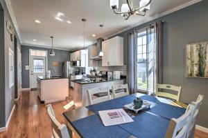 a kitchen and dining room with a table and chairs at Quaint Ligonier Family Home - 3 Miles to Idlewild! in Ligonier