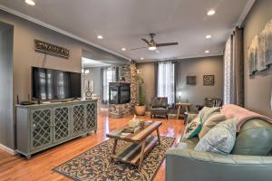 a living room with a couch and a tv at Quaint Ligonier Family Home - 3 Miles to Idlewild! in Ligonier