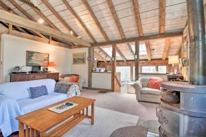 a living room with a couch and a table at Private Rustic Home - 6 Mi to Bromley Mountain! in North Landgrove