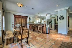 a kitchen with a table and chairs in a room at Relaxing Riverfront Oasis 5 Mi to Satellite Beach in Merritt Island