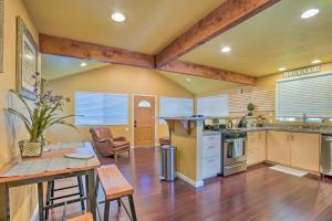 a large kitchen with a table and a dining room at Cozy Cottage with Grill - 5 Mi to Mt Baldy Resort! in Mount Baldy