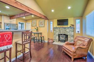 a living room with a bar and a fireplace at Cozy Cottage with Grill - 5 Mi to Mt Baldy Resort! in Mount Baldy