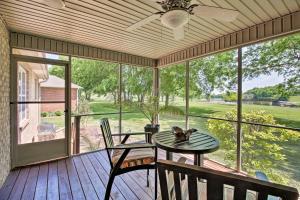 a screened in porch with a table and chairs at Gallatin House on Long Hollow Golf Course! in Gallatin