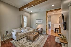 a living room with a couch and a tv at Updated Indianapolis Home, Walk to Lucas Oil! in Indianapolis
