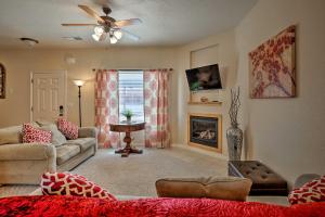 a living room with a couch and a fireplace at Kanab Condo with Pool and Patio, 30 Mi to Zion NP in Kanab