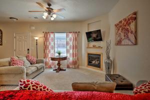a living room with a couch and a fireplace at Kanab Condo with Pool and Patio, 30mi to Zion NP! in Kanab