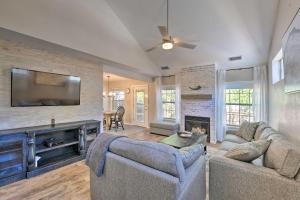 a living room with two couches and a fireplace at Modern Flagstaff Home with BBQ, Walk Downtown! in Flagstaff