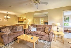 a living room with a couch and a table at Lincoln Resort Condo with Pool Access - Near Hiking! in Lincoln
