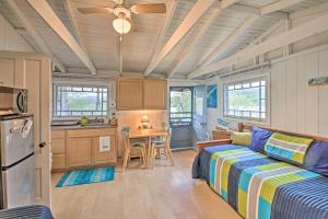 a living room with a bed and a kitchen at Newfound Lake Studio BBQ, Fire Pit and Beach Access in Bristol