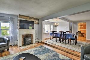 a living room with a table and a fireplace at Family Cottage on Chaumont Bay, Walk to Downtown in Chaumont