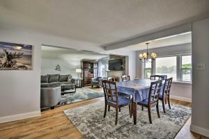 a dining room and living room with a table and chairs at Family Cottage on Chaumont Bay, Walk to Downtown in Chaumont